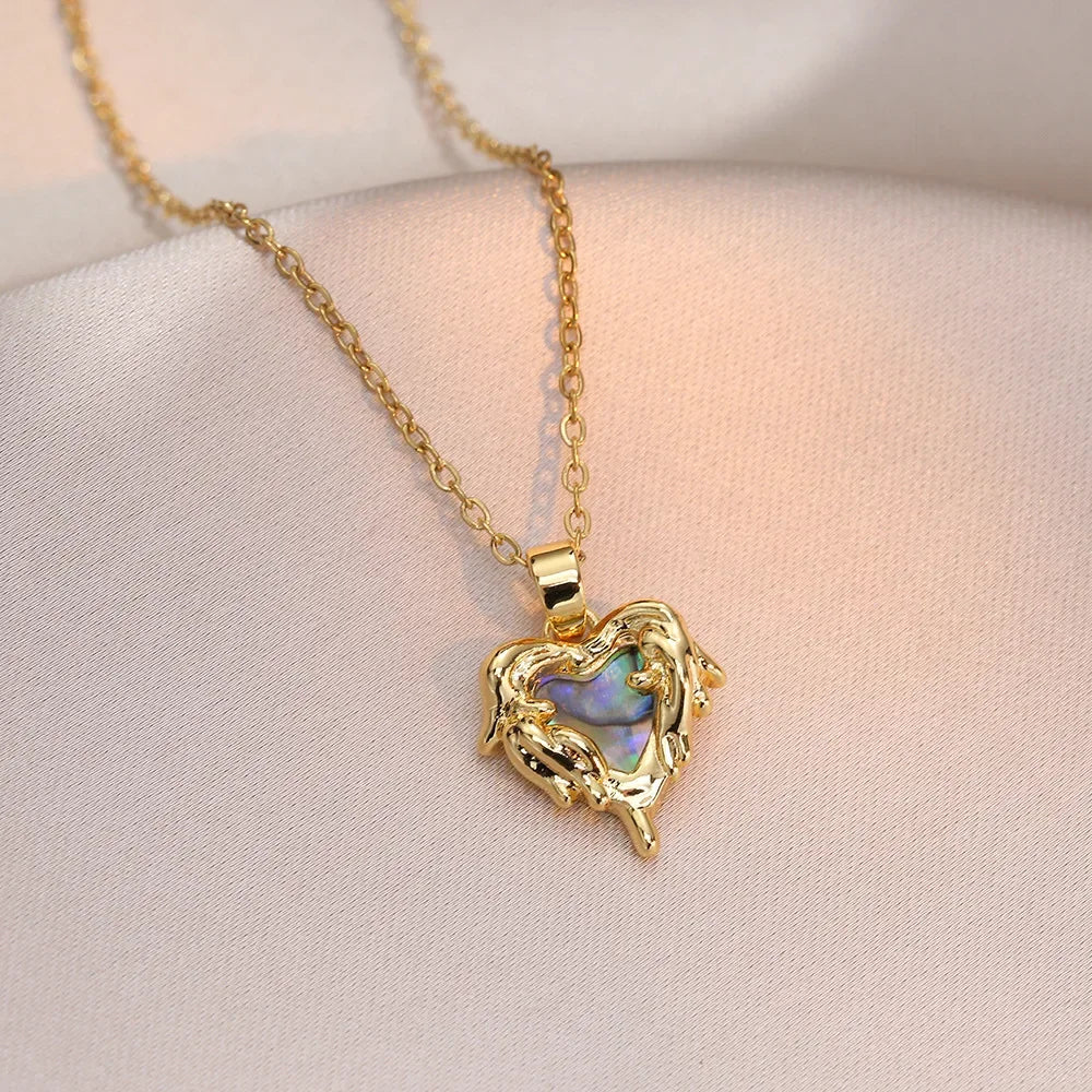 Collar elegante y lujoso de ostra con perla en forma de corazón color melocotón