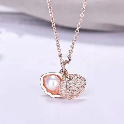 Collar elegante y lujoso de ostra con perla en forma de corazón color melocotón