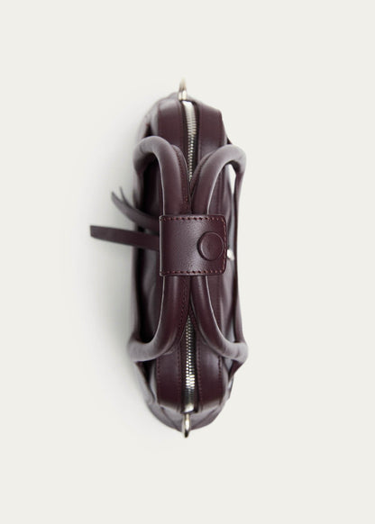 Bolso Hilma Mini de cuero vinílico color burdeos